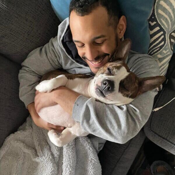Foster dad snuggling with foster dog